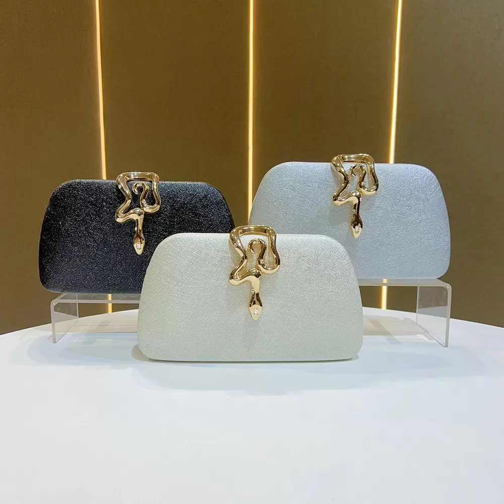 Luxury snake-shaped metal buckle evening clutch bag White shiny lady dress bag Banquet party light luxury clutch bag